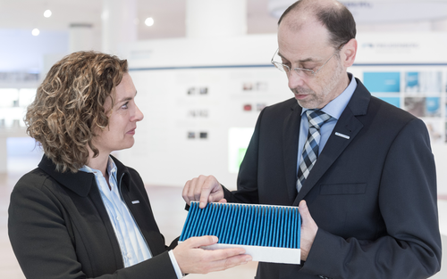 Freudenberg Filtration Technologies employees discussing quality of produced cabin air filter